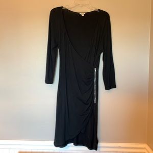 Guess slinky black dress; deep neckline; zipper; fits like a medium but tag L
